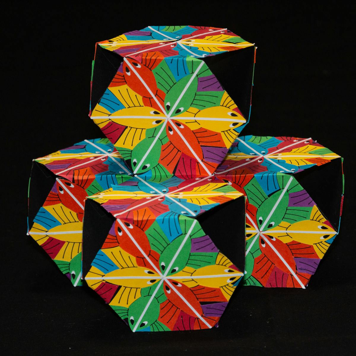 Image for entry 'Escher-inspired Fish on the {6,6|3} Polyhedron'