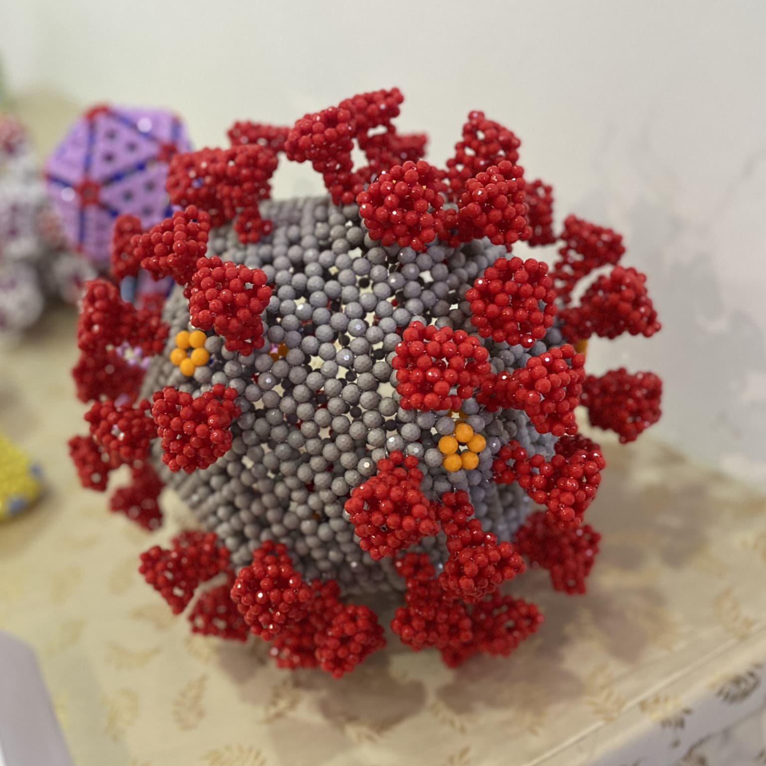 Image for entry 'Beaded sculpture of SARS-CoV-2'
