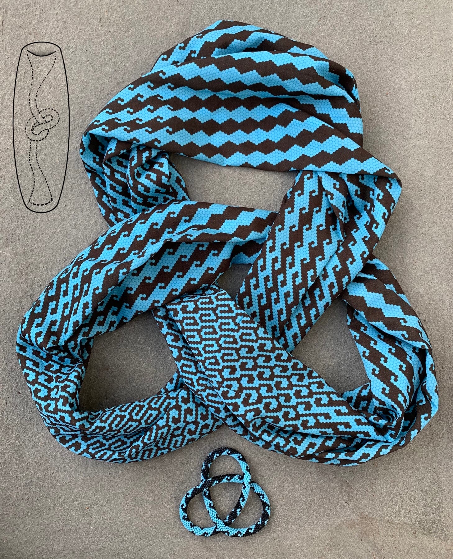 Image for entry 'Trefoil-knotted Toroidal Scarf and Bracelet'