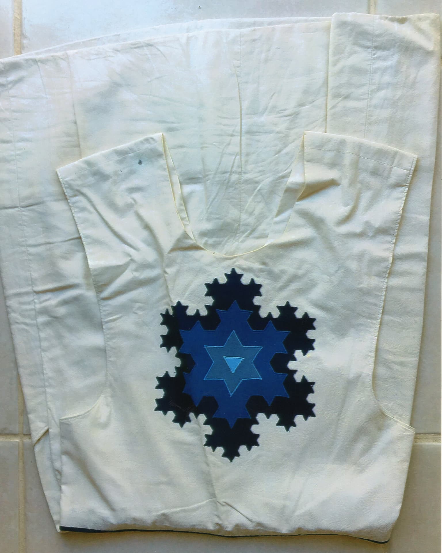 Image for look 'Blazer with approximate logarithmic spirals in the design, Jumper with Sierpinski's Triangle on the bib, Koch Curve Jumper, t-shirts with Leonardo daVinci designs embroidered'