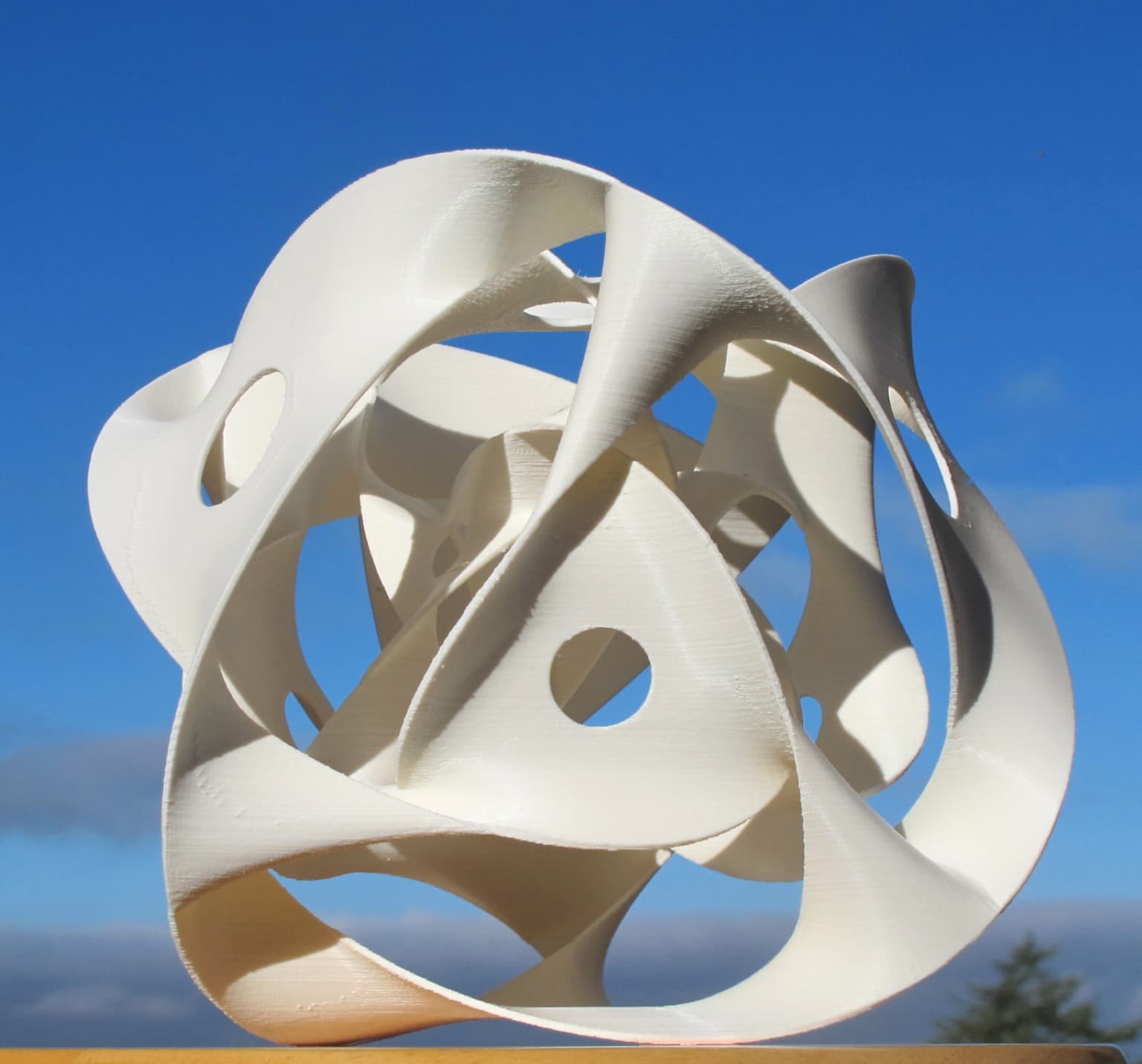 Image for entry '3-Level Borromean Soap Film, Bordered by Three Intertwined Torus Knots'